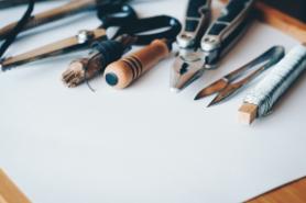 A picture of a series of tools lying on paper