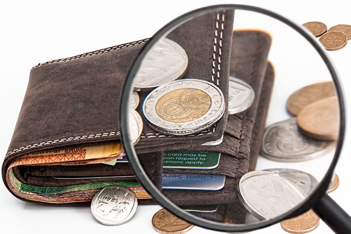 Finance: wallet with magnifying glass